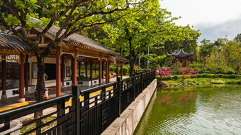 The covered walkway and pavilions provide shelter from the sun and rain. The lake pavilion provides seating for visitors to relax and enjoy views of the lake.